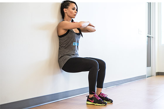 woman doing a wall sit