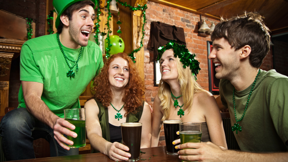 friends enjoying the bar and dressed in saint patricks day attire