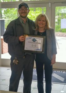 chuck posing for his picture as employee of the quarter