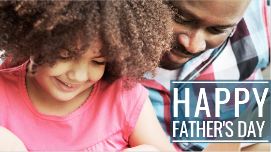 happy fathers day - father and daughter reading a book